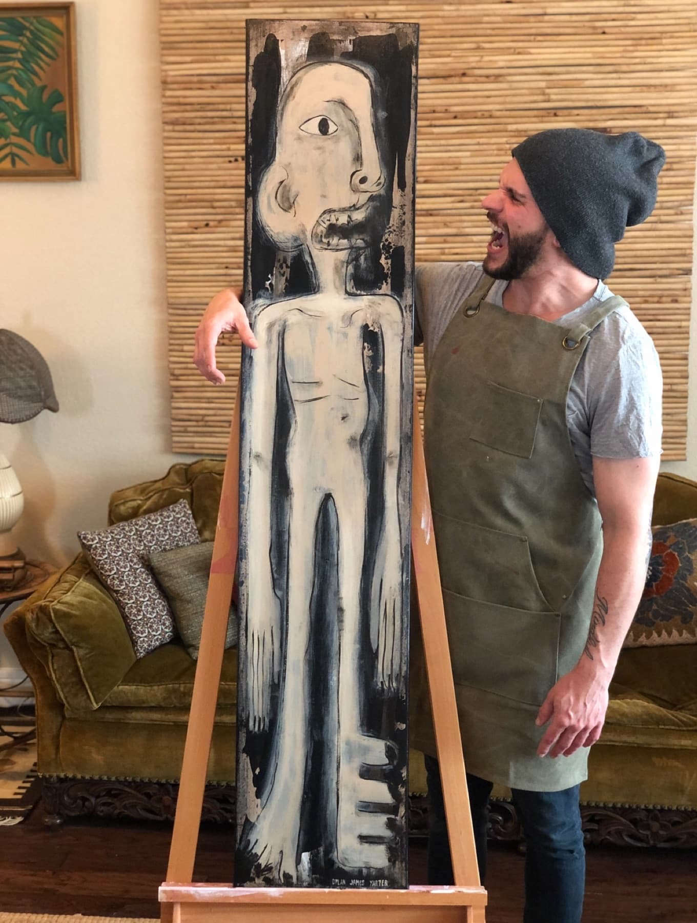 Dylan Yarter in the studio beside his painting Aborigine
